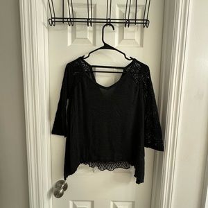 Plain front, lace backing and sleeves. Quarter length sleeves